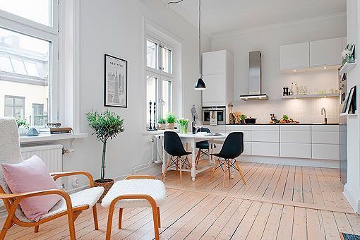 Cocina abierta al salón de un apartamento femenino Cocina abierta al salón de un apartamento femenino