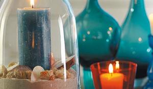 centro-de-mesa-con-velas-y-arena.jpg