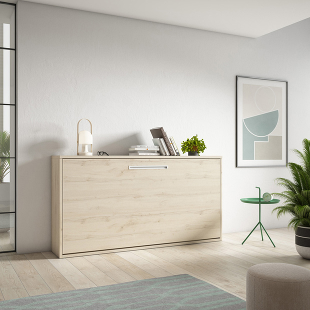 Cama plegable en un mueble pegado a la pared