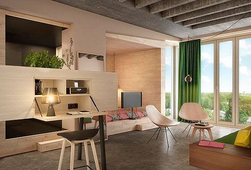 Habitación decorada en tonos cálidos de un hotel en Berlín