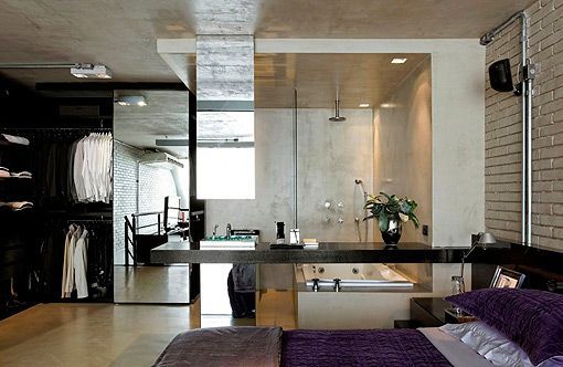 Loft industrial: dormitorio con baño integrado y vestidor